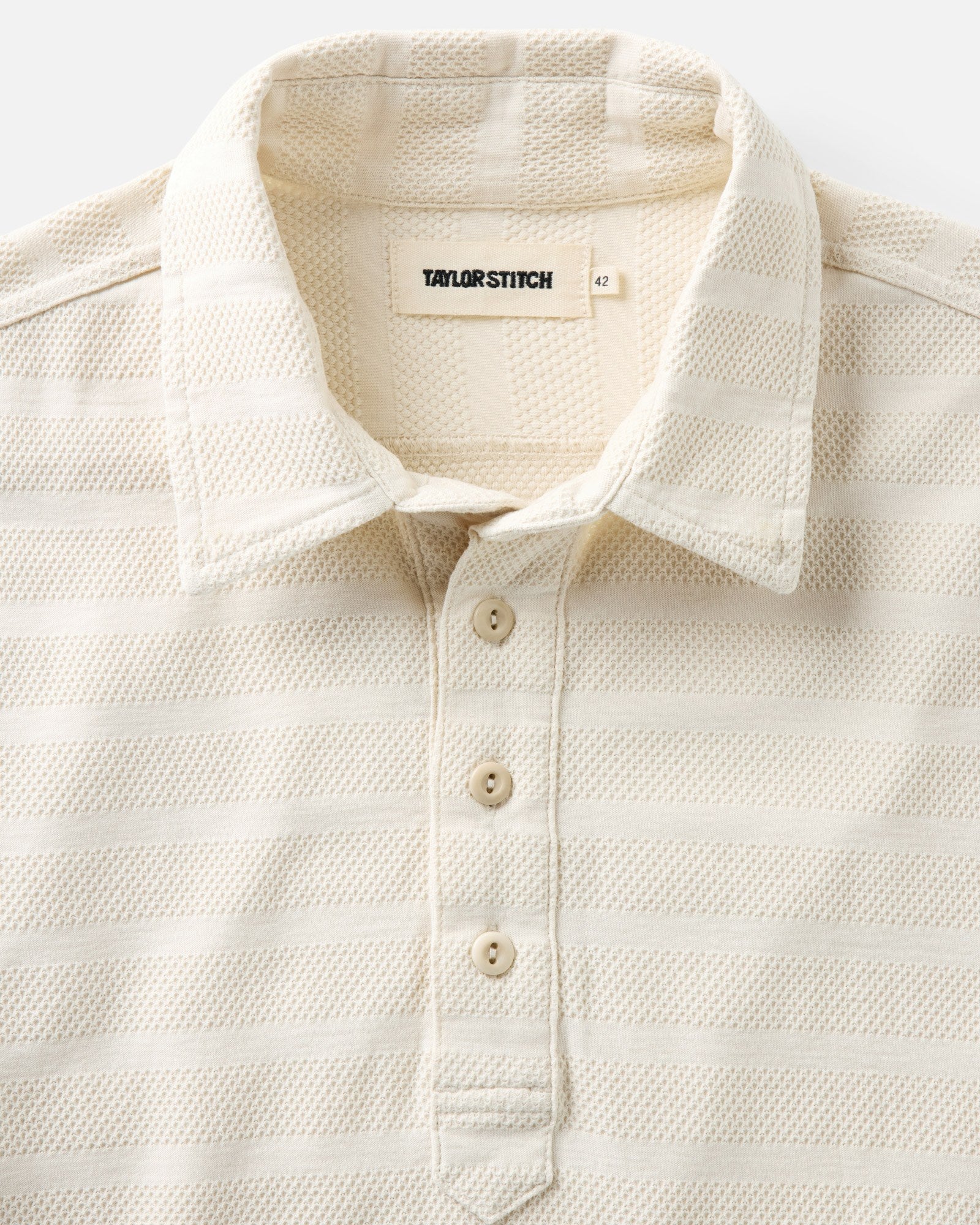 material shot of the collar on The Long Sleeve Polo in Vintage White Knit Stripe, Knits by Taylor Stitch