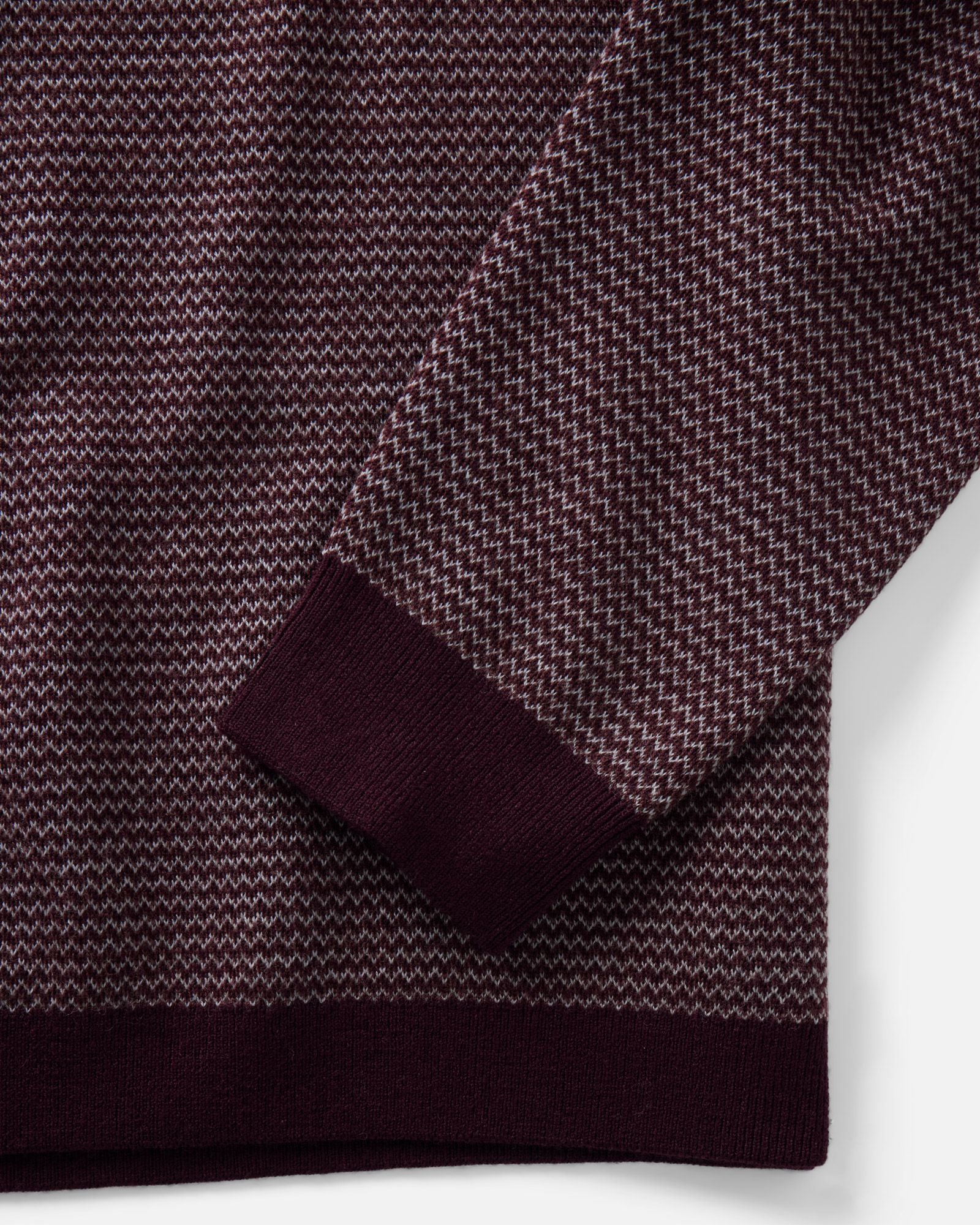 material shot of the sleeve on The Newton Sweater Polo in Burgundy Birdseye Merino, Knits by Taylor Stitch