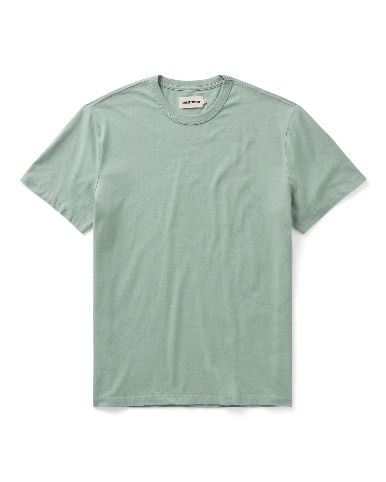flatlay of The Regenerative Cotton Tee in Faded Pine, Knits by Taylor Stitch