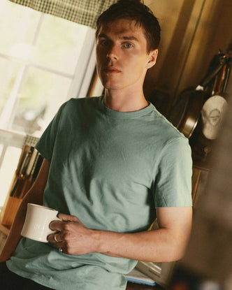 fit model showing off The Regenerative Cotton Tee in Faded Pine