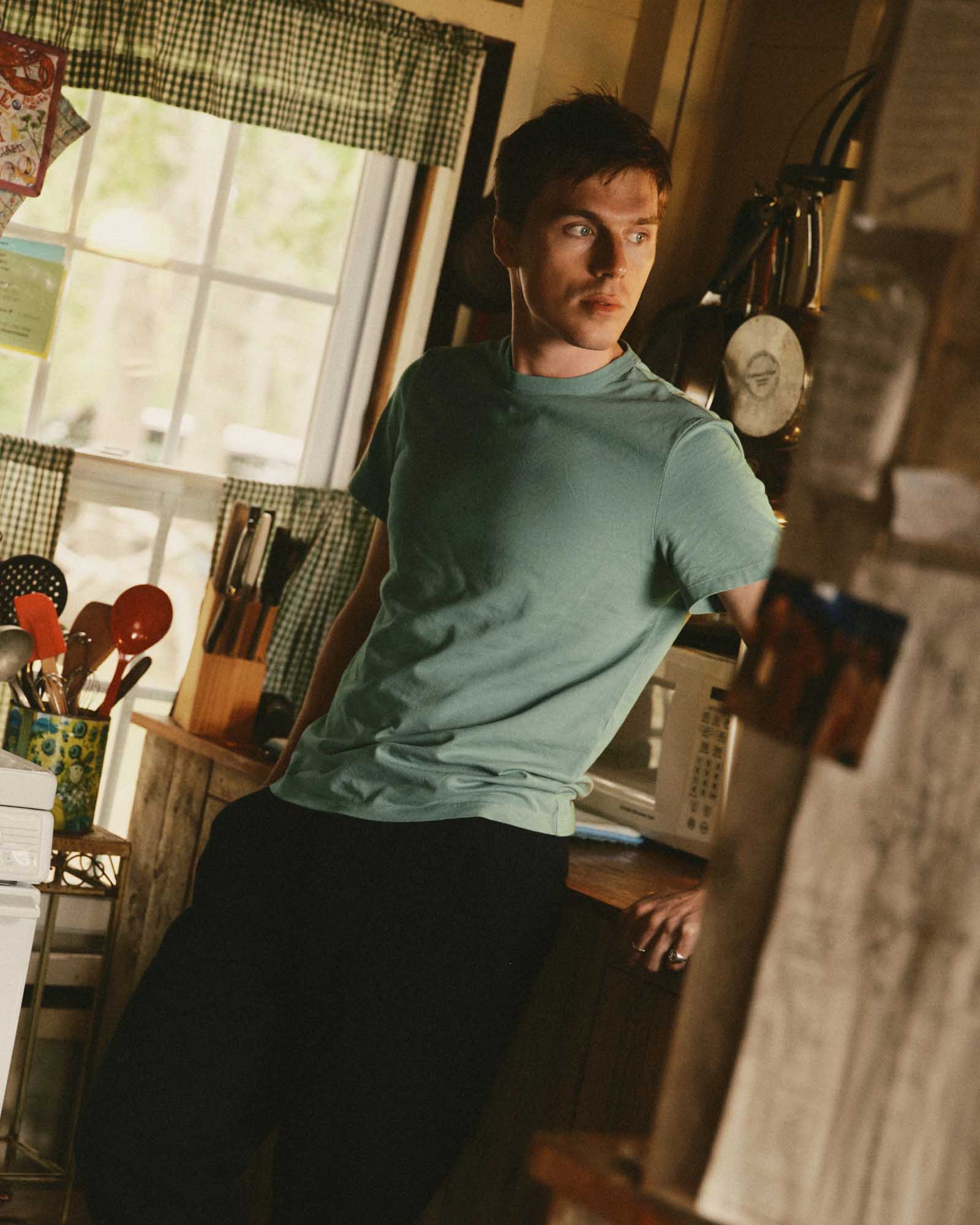 fit model posing in The Regenerative Cotton Tee in Faded Pine, Knits by Taylor Stitch