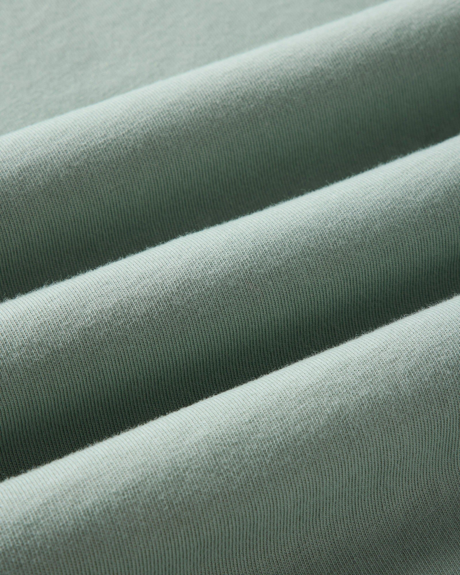 material shot of the fabric on The Regenerative Cotton Tee in Faded Pine, Knits by Taylor Stitch