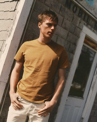 fit model posing in The Regenerative Cotton Tee in Saffron