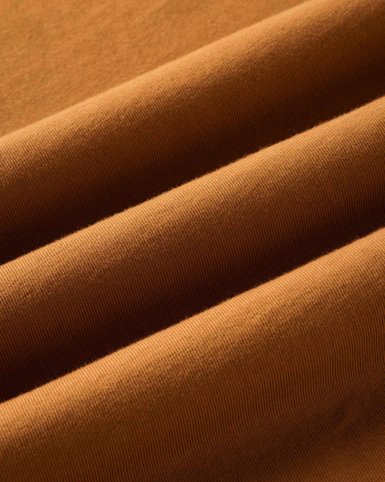 material shot of the fabric on The Regenerative Cotton Tee in Saffron, Knits by Taylor Stitch