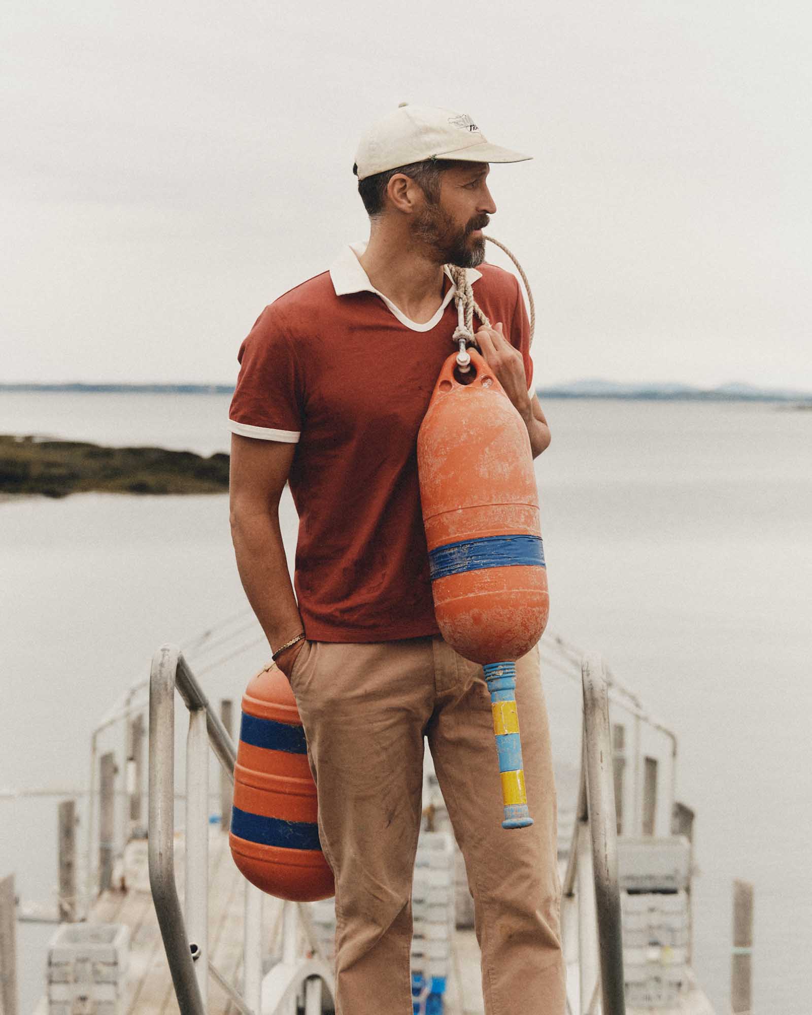 fit model posing in The Ripper Polo in Canyon, Knits by Taylor Stitch