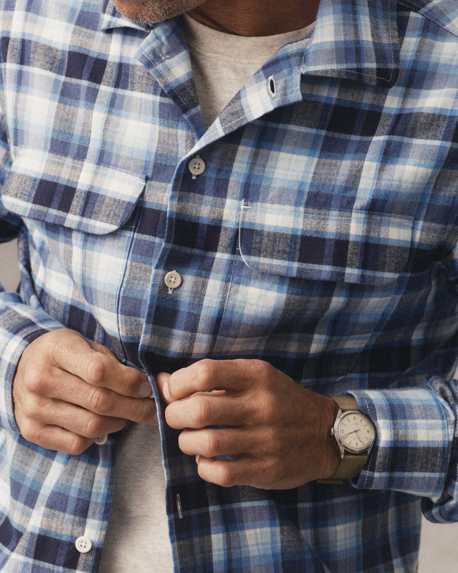fit model buttoning up The Shore Shirt in Deepwater Check Portuguese Flannel, Wovens by Taylor Stitch