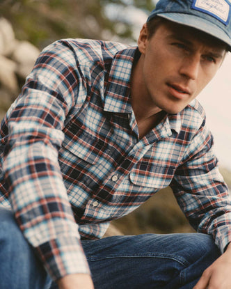 fit model sitting wearing The Shore Shirt in Harbor Check Portuguese Flannel