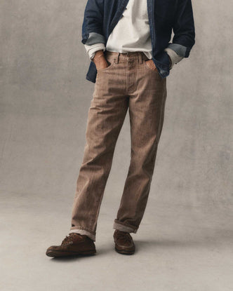 fit model with his hands in his pockets wearing The Straight Jean in Kakishibu Selvedge