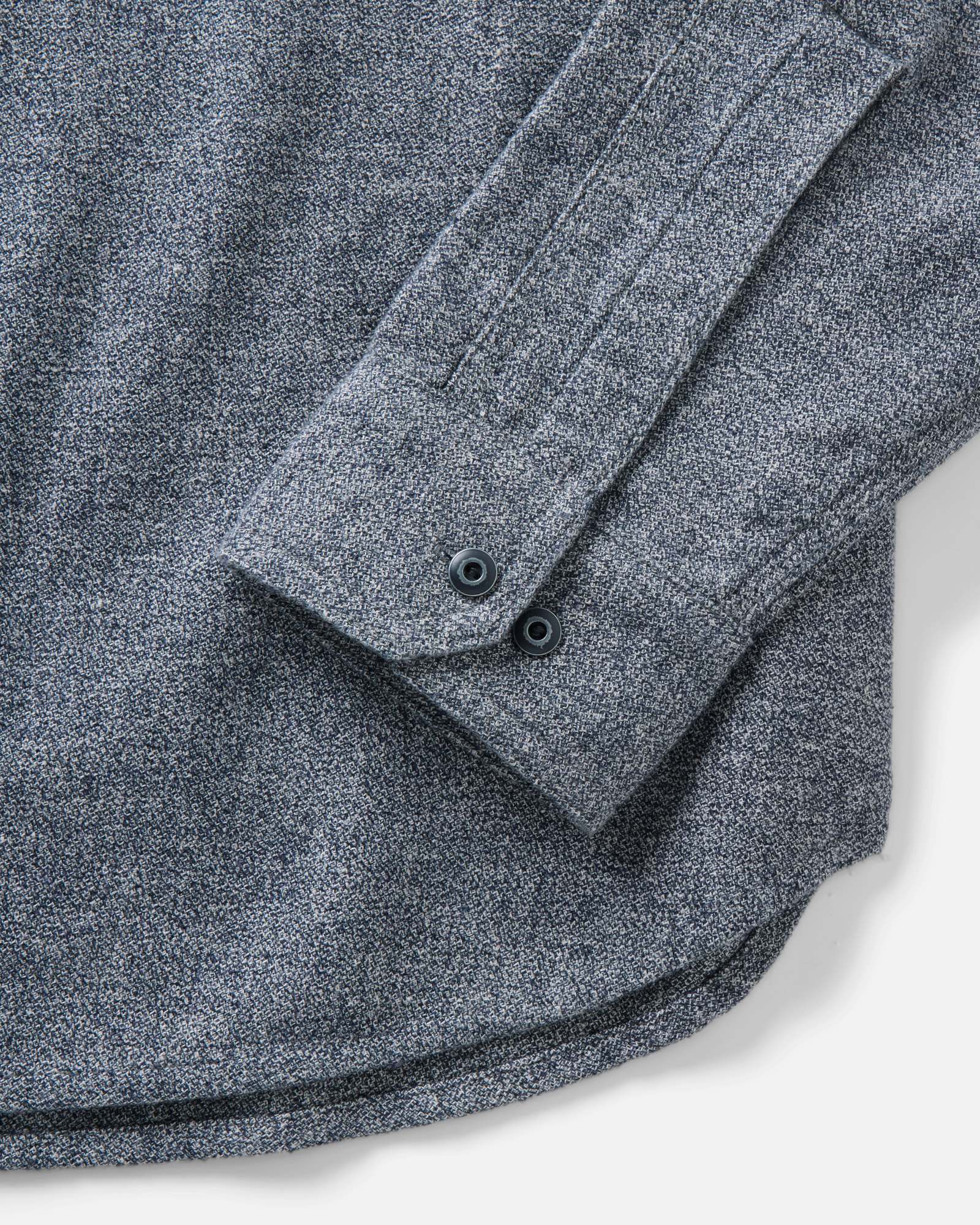 material shot of the sleeve on The Tiller Half Zip in Greyscale Hemp Jaspe, Wovens by Taylor Stitch
