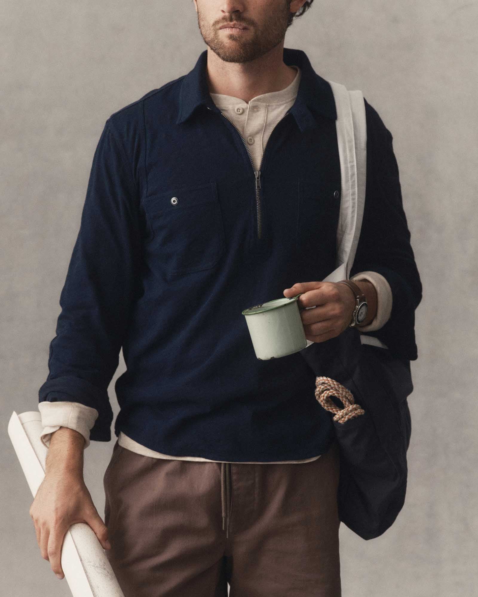 fit model showing off The Tiller Half Zip in Rinsed Indigo Slub, Knits by Taylor Stitch