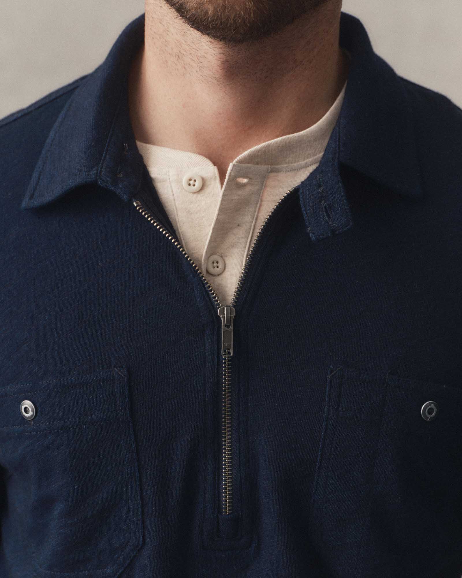 fit model showing off the collar on The Tiller Half Zip in Rinsed Indigo Slub, Knits by Taylor Stitch