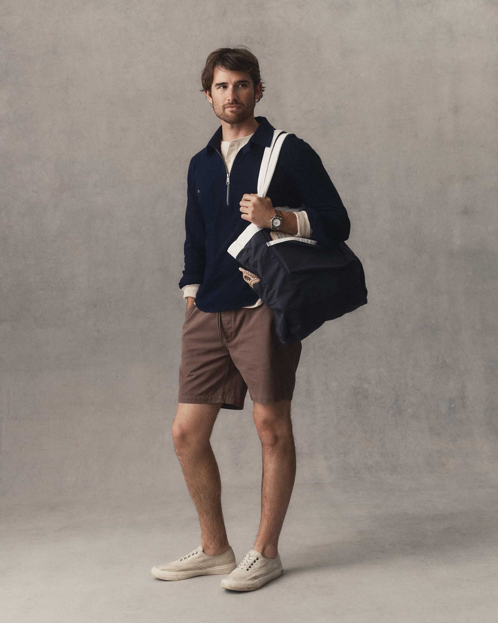 fit model posing in The Tiller Half Zip in Rinsed Indigo Slub, Knits by Taylor Stitch