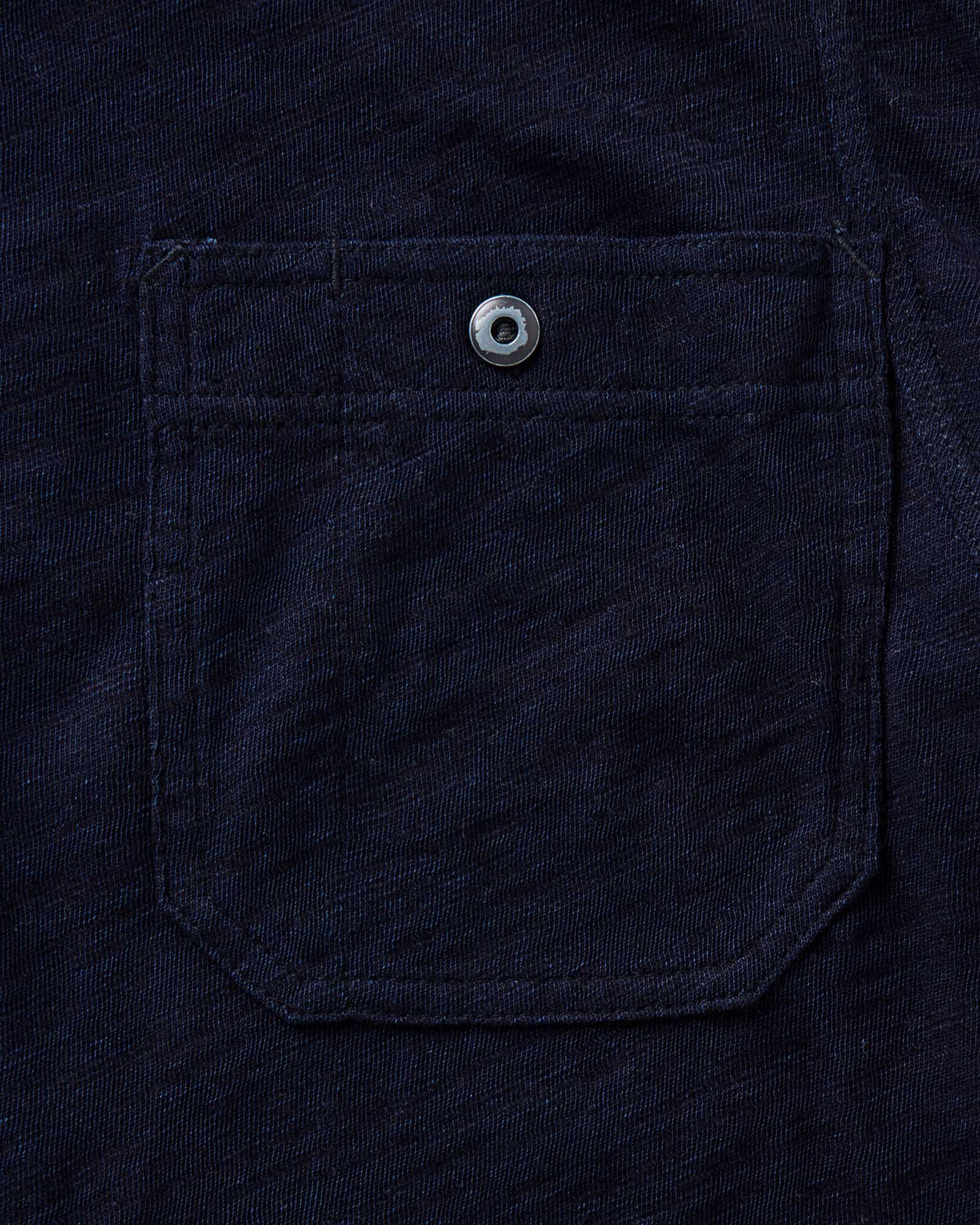 material shot of the pocket on The Tiller Half Zip in Rinsed Indigo Slub, Knits by Taylor Stitch