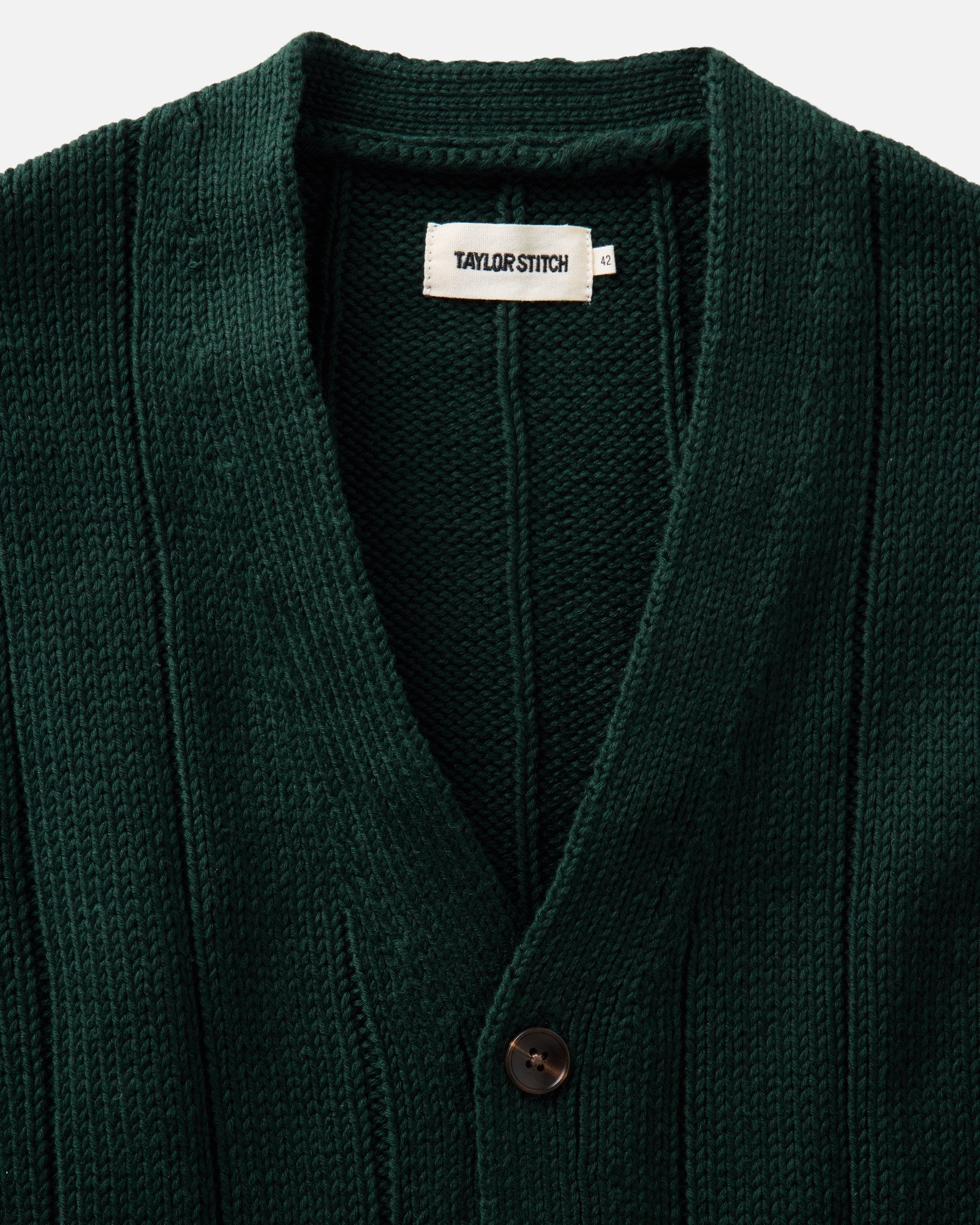 material shot of the collar on The Trench Cardigan in Dark Forest Rib Linen, Knits by Taylor Stitch