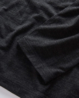 material shot of the sleeves on The Merino Henley in Heather Black, Knits by Taylor Stitch