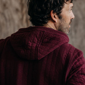 fit model showing the back of The Apres Zip Hoodie in Burgundy Quilt