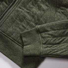 material shot of the ribbed cuffs and hem on The Apres Zip Hoodie in Fatigue Olive Quilt