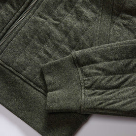 material shot of the ribbed cuffs and hem on The Apres Zip Hoodie in Fatigue Olive Quilt