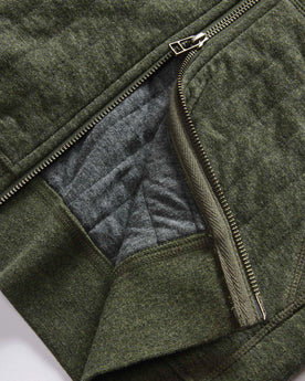 material shot of the two-way YKK zipper on The Apres Zip Hoodie in Fatigue Olive Quilt, Knits by Taylor Stitch