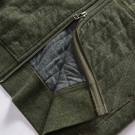 material shot of the two-way YKK zipper on The Apres Zip Hoodie in Fatigue Olive Quilt