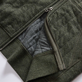 material shot of the two-way YKK zipper on The Apres Zip Hoodie in Fatigue Olive Quilt