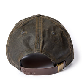 material shot of the leather slide adjustment on The Ball Cap in Soil Waxed Canvas
