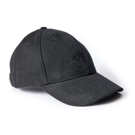 flatlay of The Ball Cap in Coal Canvas, from an angle