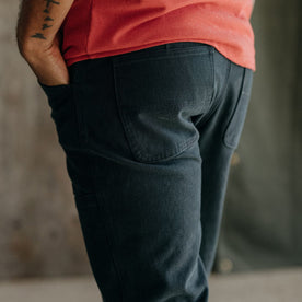 fit model showing the back of The Chore Pant in Coal Boss Duck