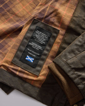 material shot of the Halley Stevensons label on The Clutch Jacket in Soil Waxed Canvas, Outerwear by Taylor Stitch