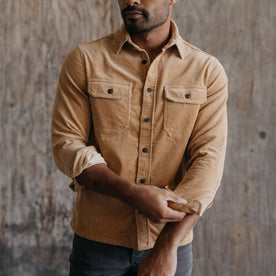 fit model adjusting his sleeves in The Connor Shirt in Camel Cord
