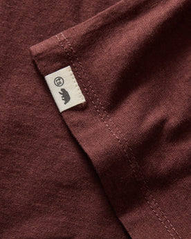 material shot of the hem and TS label on The Cotton Hemp Long Sleeve Tee in Burgundy, Knits by Taylor Stitch