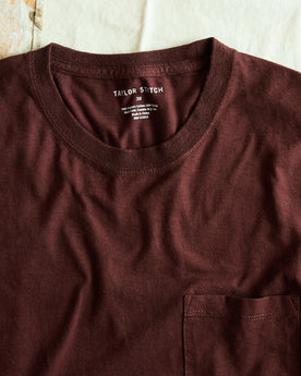 stylized shot of the neck opening on The Cotton Hemp Long Sleeve Tee in Burgundy, Knits by Taylor Stitch