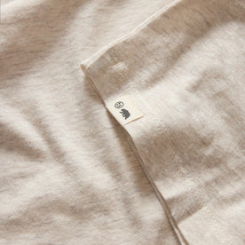 material shot of the hem and TS label on The Cotton Hemp Long Sleeve Tee in Heathered Oat