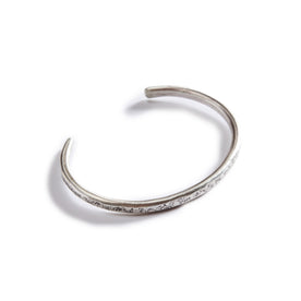 flatlay of The Hammered Cuff in Silver, from the top