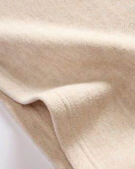 material shot of the hem on The Evans Crew in Oat Birdseye Wool, Knits by Taylor Stitch