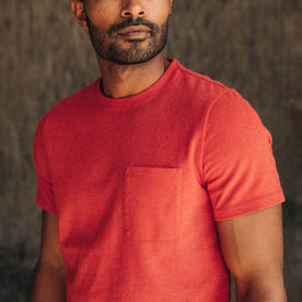 fit model showing the front chest pocket on The Heavy Bag Tee in Cardinal