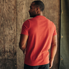 fit model showing the back of The Heavy Bag Tee in Cardinal