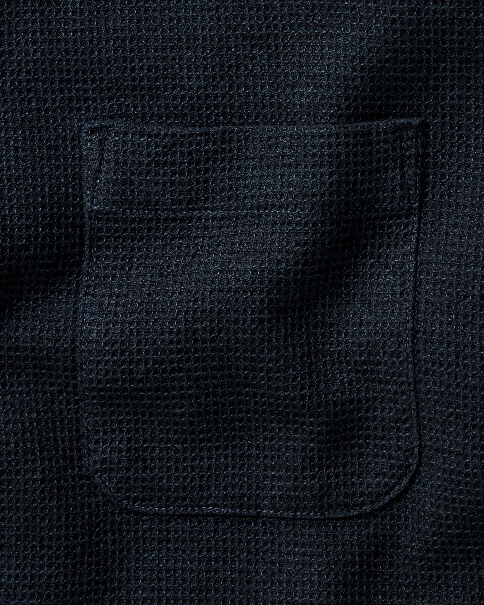 fit model sitting in The Jack in Forest Waffle, Wovens by Taylor Stitch