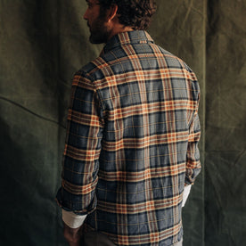 fit model showing the back of The Ledge Shirt in Conifer Plaid