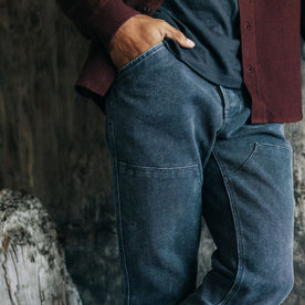 fit model with his hand in the pocket of The Lined Chore Pant in Navy Chipped Canvas