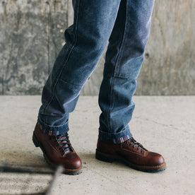 fit model showing the reinforced knees on The Lined Chore Pant in Navy Chipped Canvas