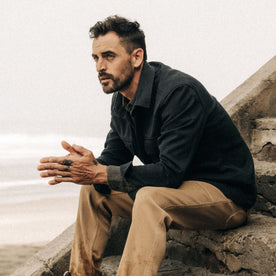 fit model sitting in The Lined Shop Shirt in Coal Boss Duck