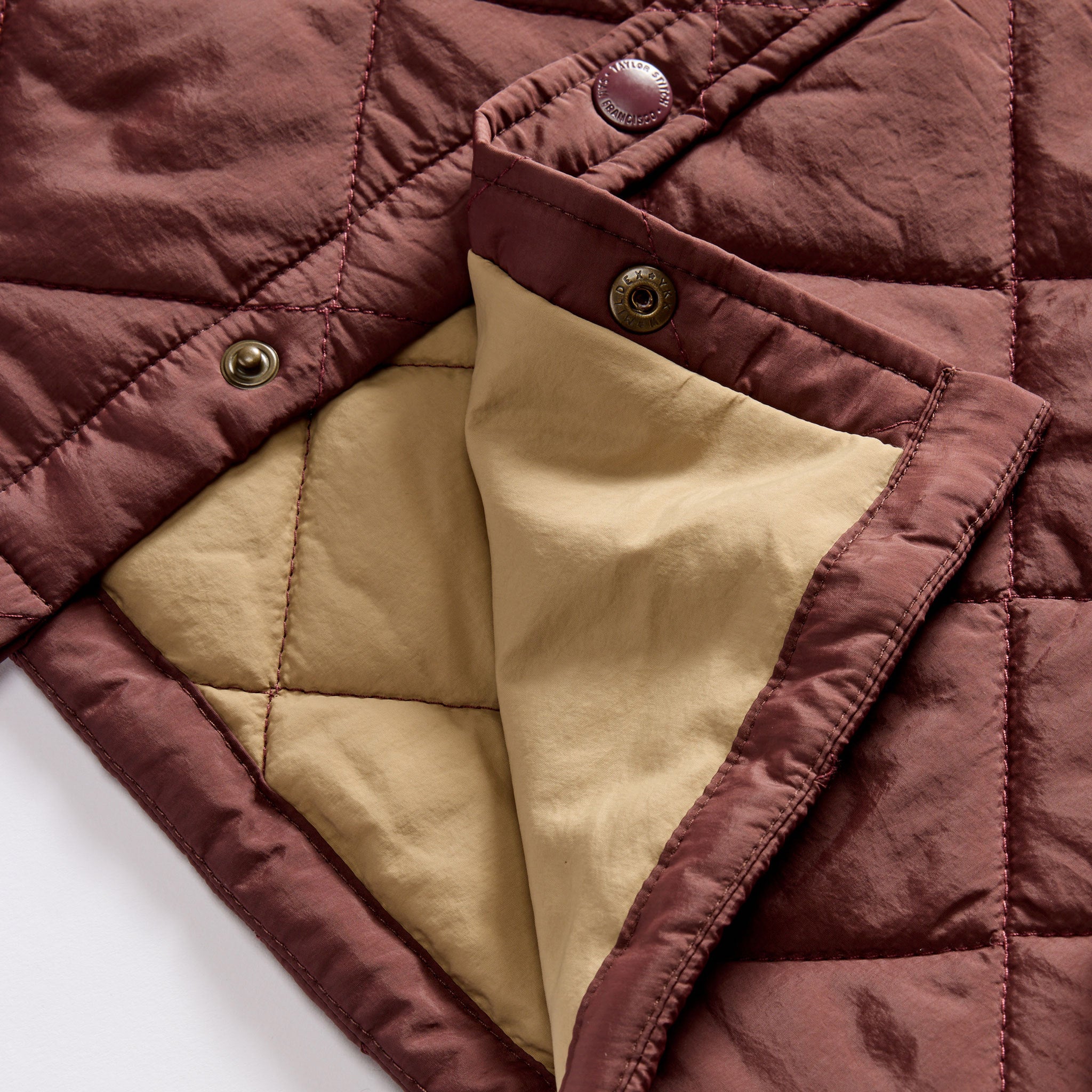 material shot of the snap buttons on The Miller Shirt Jacket in Burgundy, Outerwear by Taylor Stitch