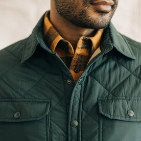 fit model showing the front of The Miller Shirt Jacket in Conifer