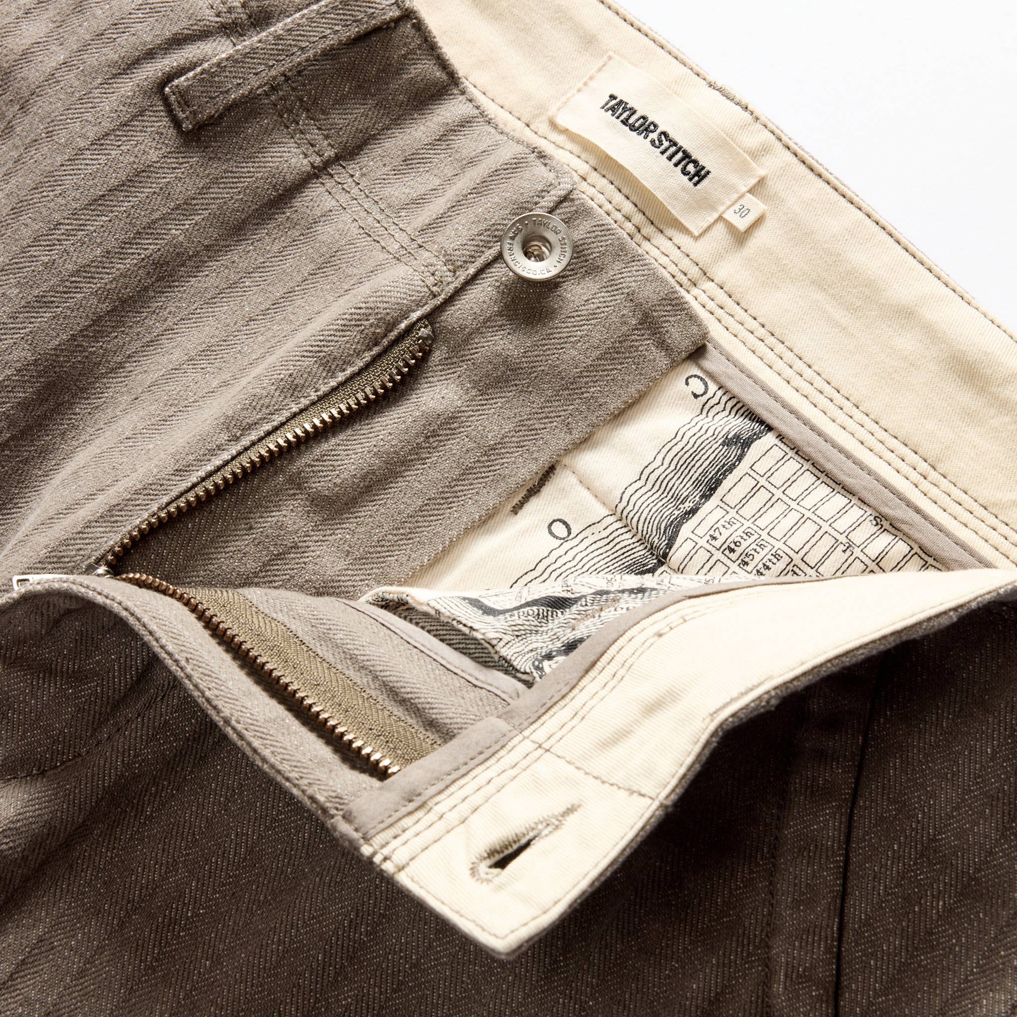 material shot of the zipper fly on The Morse Pant in Smoked Olive Herringbone Twill, Bottoms by Taylor Stitch