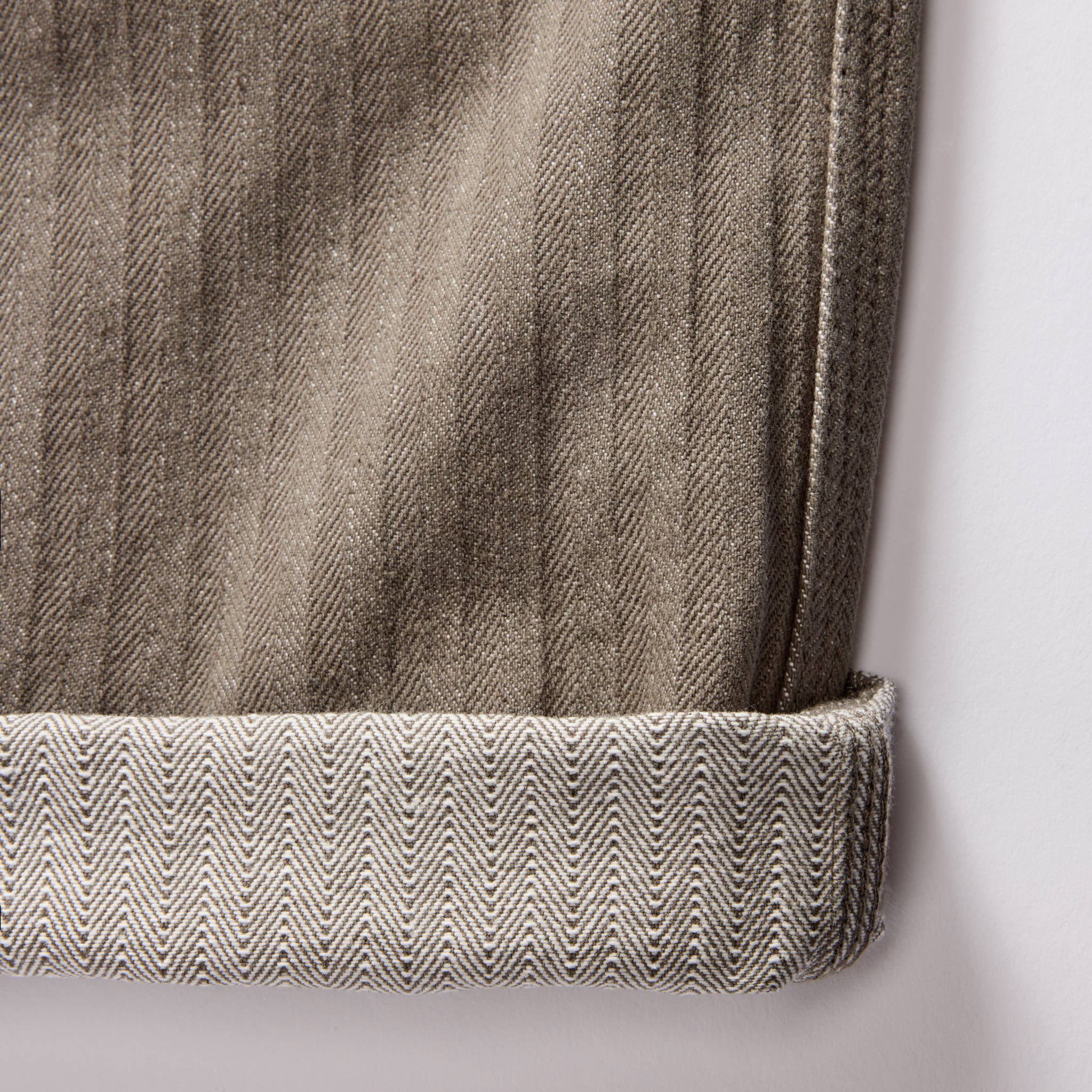 material shot of the herringbone texture on The Morse Pant in Smoked Olive Herringbone Twill, Bottoms by Taylor Stitch