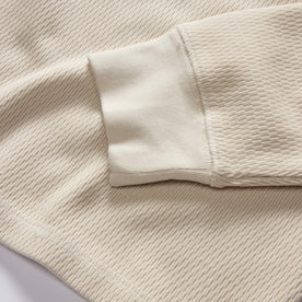 material shot of the ribbed cuffs on The Organic Cotton Waffle Crew in Natural