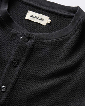 material shot of the neck opening and front placket on The Organic Cotton Waffle Henley in Coal, Knits by Taylor Stitch
