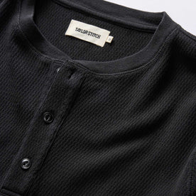 material shot of the neck opening and front placket on The Organic Cotton Waffle Henley in Coal