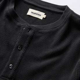 material shot of the neck opening and front placket on The Organic Cotton Waffle Henley in Coal